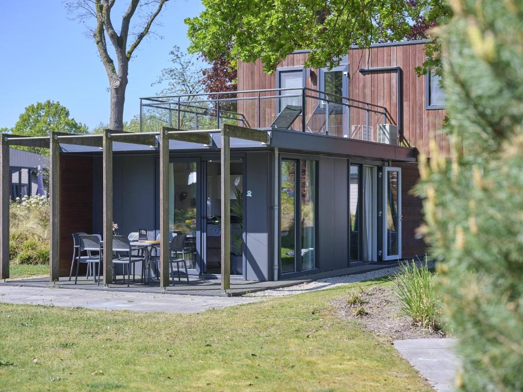 a glass extension of a house with a patio at L Etage in Kaatsheuvel