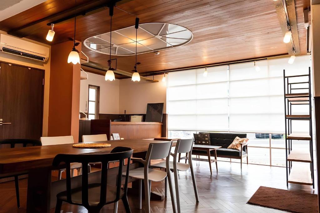 a dining room with a table and chairs at Shimanto Hutte in Shimanto-cho