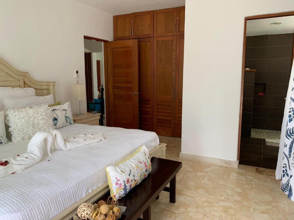a bedroom with a large bed and a mirror at Las Marías in El Morón