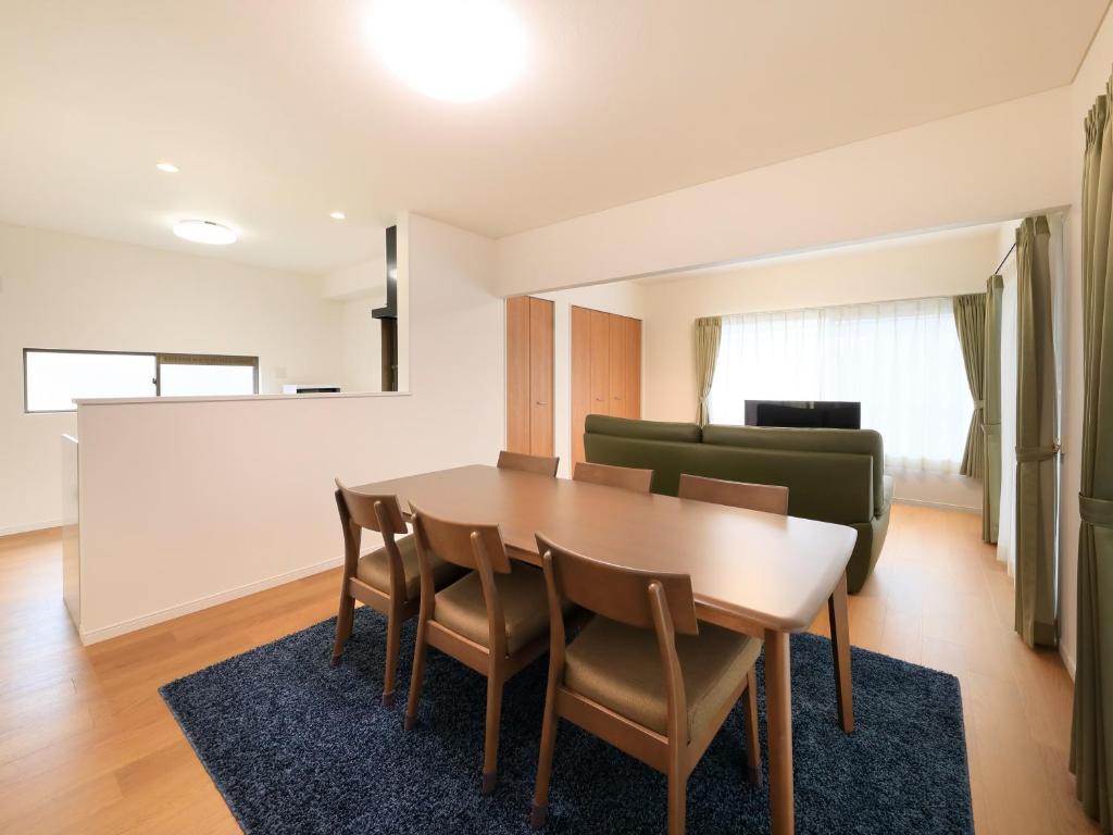 a dining room with a table and chairs at Knowledge House in Odawara
