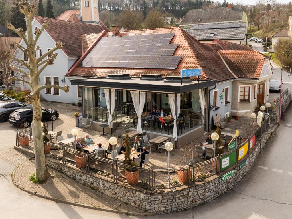 an overhead view of a house with solar panels on it at Gasthof Kraxner in Hatzendorf