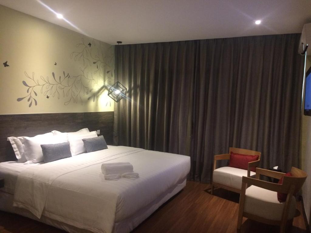 Postel nebo postele na pokoji v ubytování Rooms