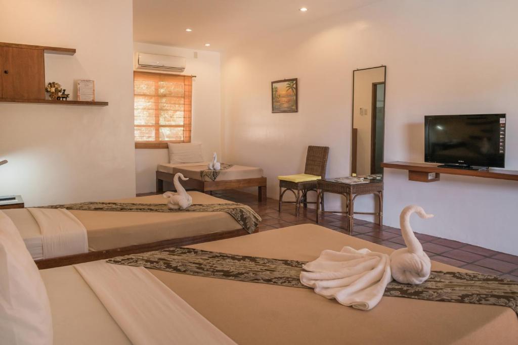 TV a/nebo společenská místnost v ubytování Acacia Tree Garden Hotel