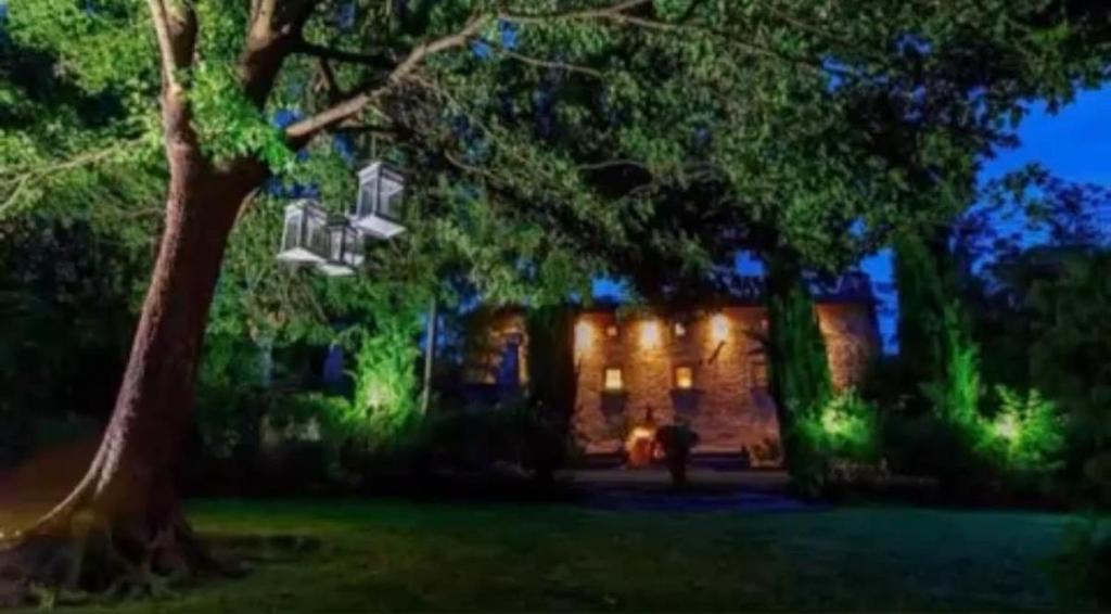 a house with a tree in front of it at Borgo Spescia Pool Park and Relaxation in Camposonaldo