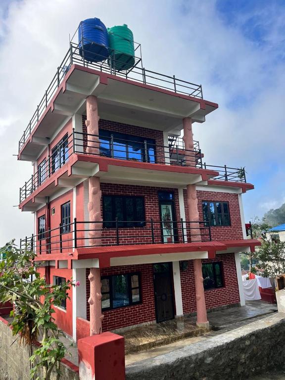 a building with chairs on top of it at Hotel PeaceFul in Bandipur