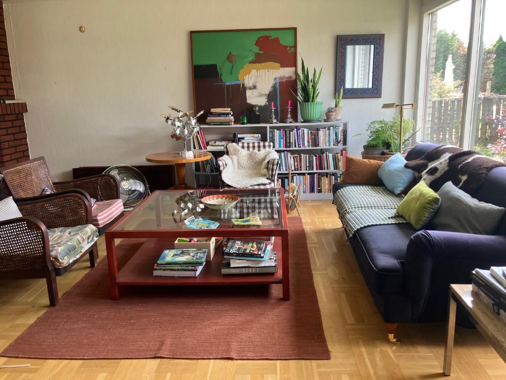 a living room with a couch and a coffee table at Bra familjeboende Vitaby in Vitaby