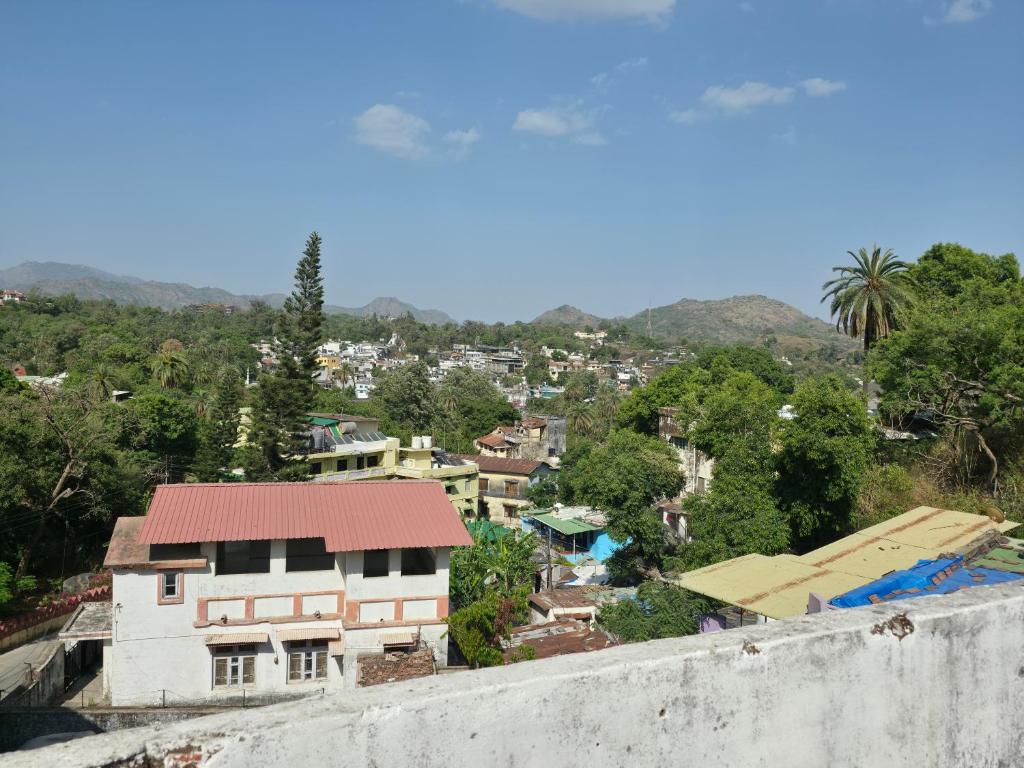a view of a city from the top of a building at Jodhpur House Mount Abu in Mount Ābu