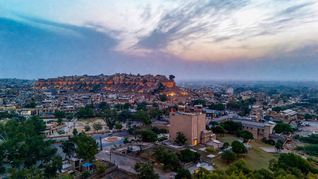 an aerial view of a city with a mountain at Hotel Aurea Jaisalmer in Jaisalmer