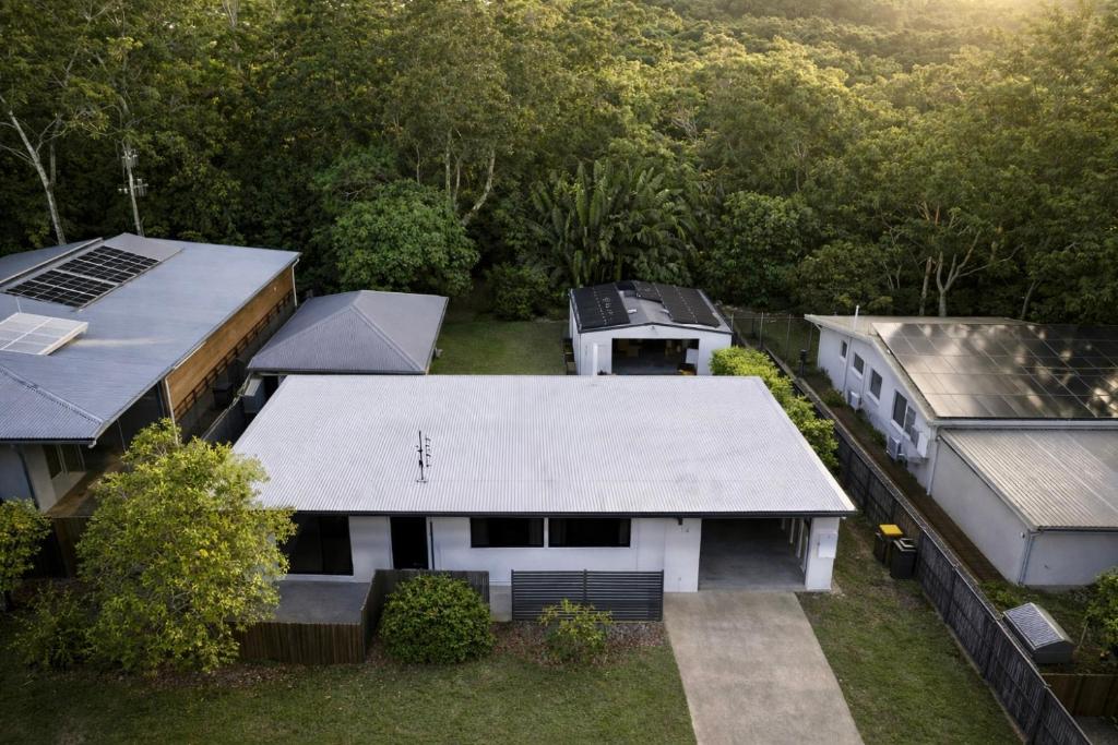 an aerial view of a white house with trees at Rainbow House in Rainbow Beach