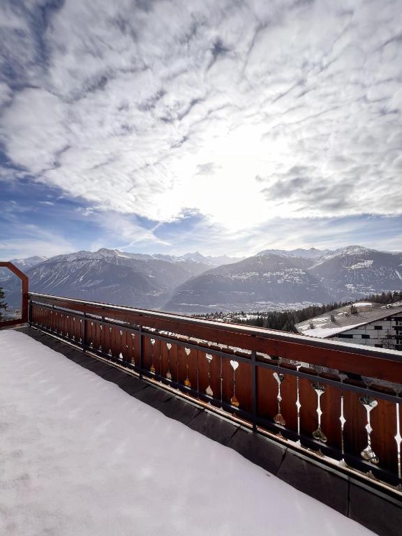 a view of the mountains from the roof of a building at Evasion Alpine in Crans-Montana
