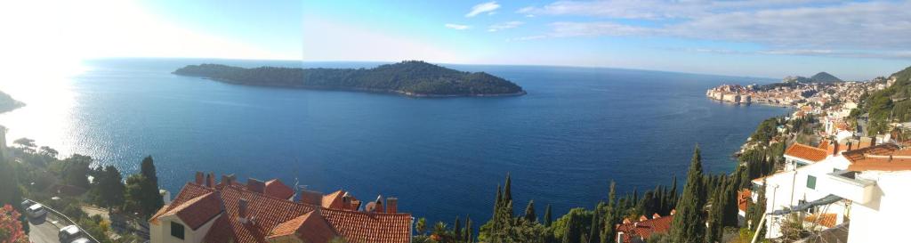 a view of a large body of water with houses and a city at Belvedere Studio in Dubrovnik