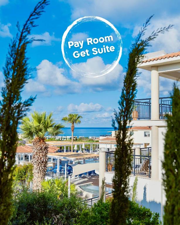 a view of a resort with the text pay room get suite at WellClub Resort - Suites & Wellness in Paphos
