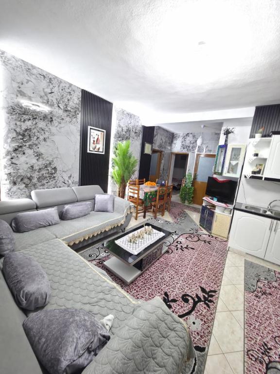 a living room with a couch and a table at Villa Kena in Ksamil