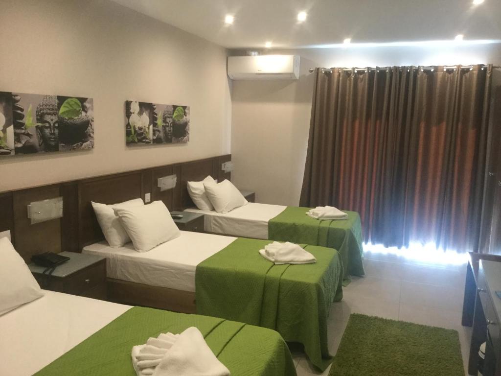 Letto o letti in una camera di Cerviola Hotel