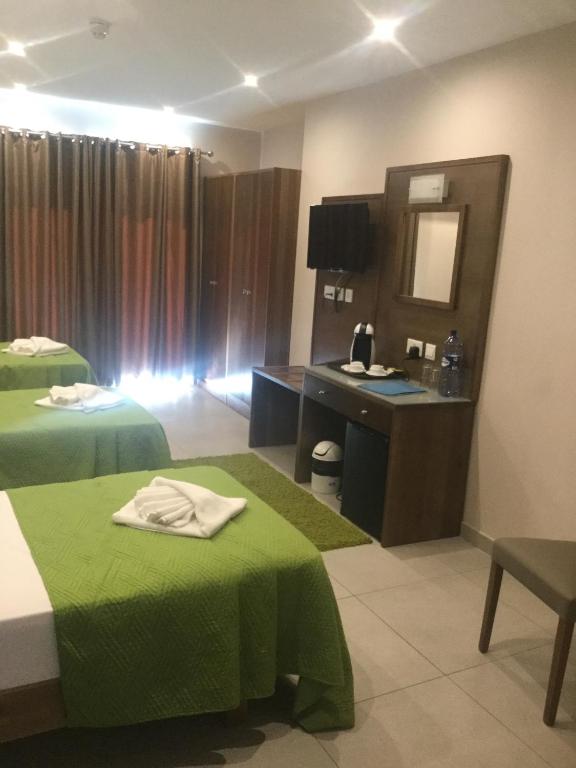 Letto o letti in una camera di Cerviola Hotel