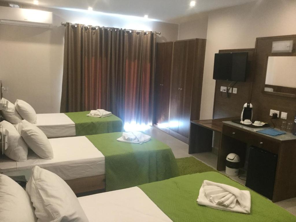 Letto o letti in una camera di Cerviola Hotel