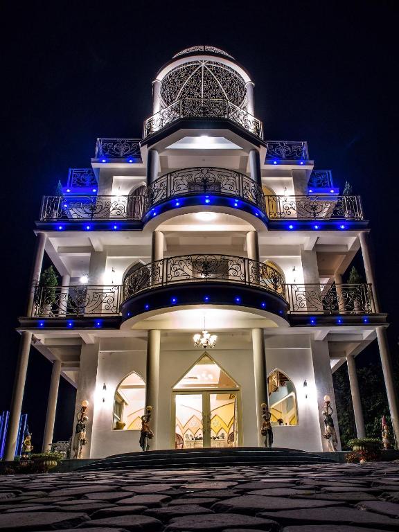 a large building with blue lights on it at Bliss Bed and Breakfast in Yuchi