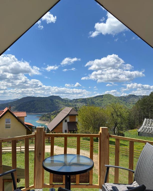 a view from a deck with a table and chairs at Apartmani Tara House in Milekići