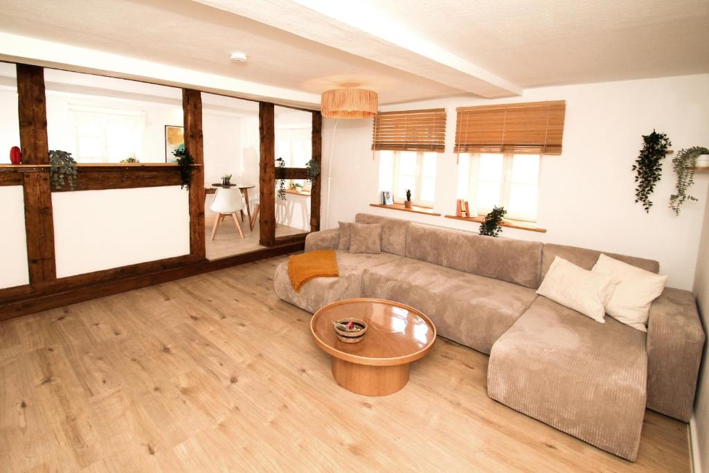 a living room with a couch and a table at THEFIVE60 Apartments in Braunlage