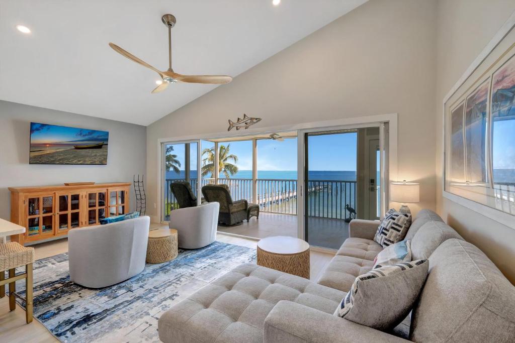 a living room with a couch and a table at Captiva Hide A Way 2B in Captiva