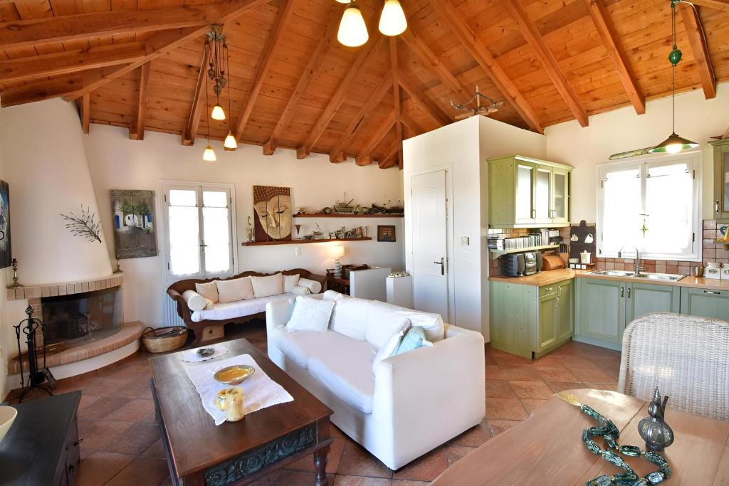 a living room with a couch and a table at Casa di Spetses in Spetses