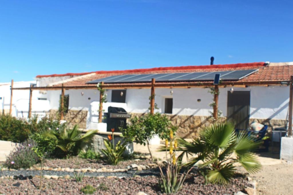 a house with solar panels on the roof at Casa Ruby in Huércal-Overa