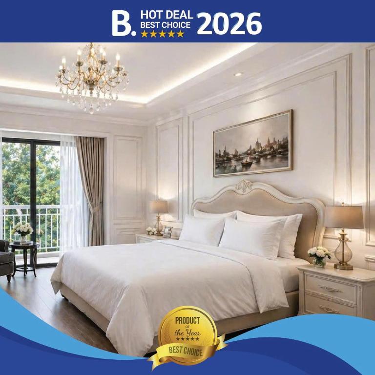 a white bedroom with a large bed and a chandelier at Evermist Resort DaLat in Da Lat