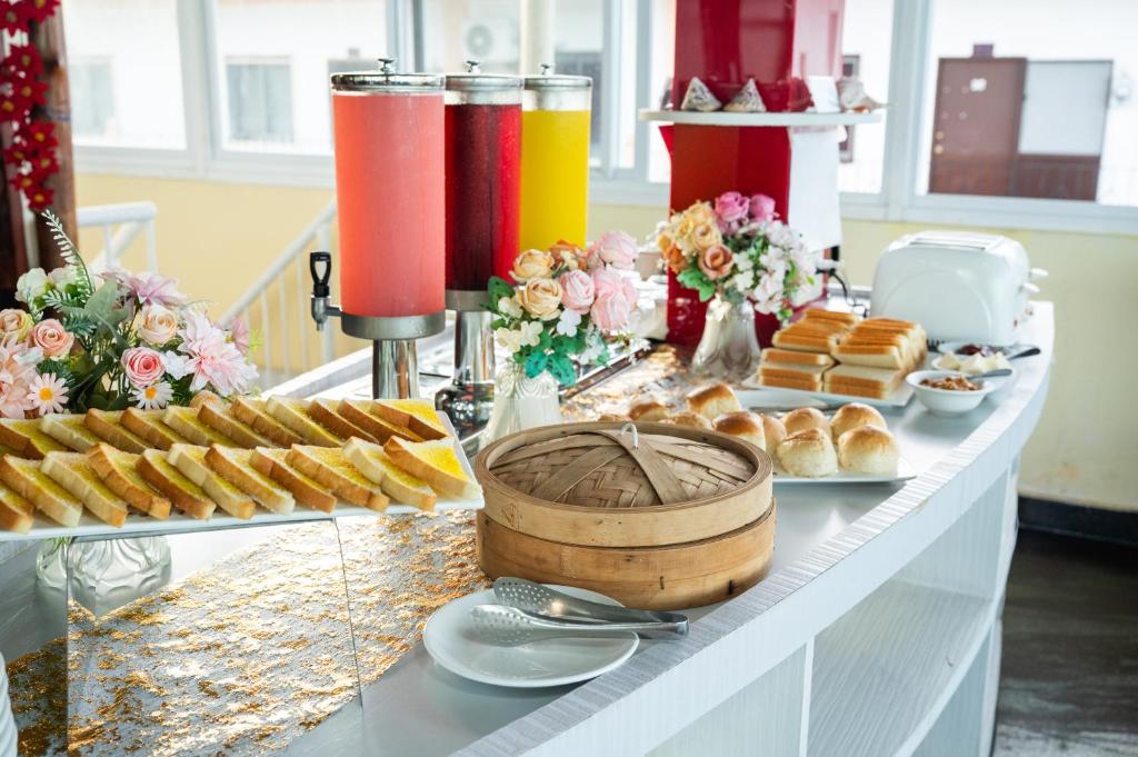 a buffet of pastries and drinks on a table at Ocean Star Hotel in Koror