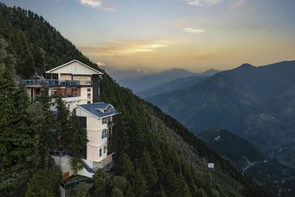 a building on the side of a mountain at Echor Alpine Meadows Khajjiar Dalhousie in Khajjiar 