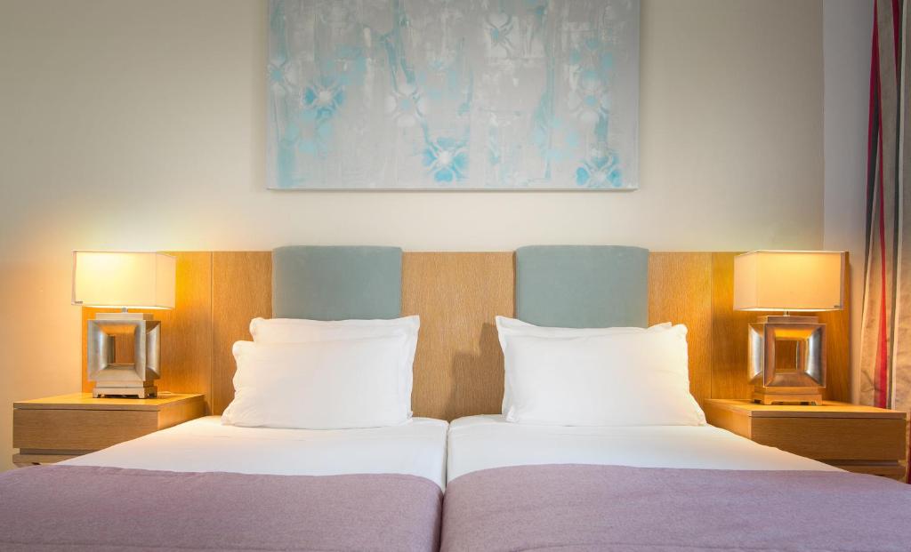 Postel nebo postele na pokoji v ubytování Alkion Hotel