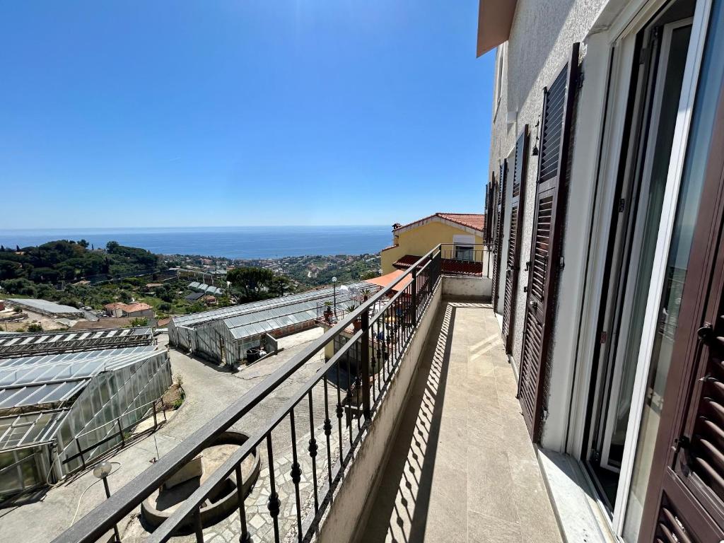 a balcony of a building with a view of the ocean at Il Colle in Sanremo
