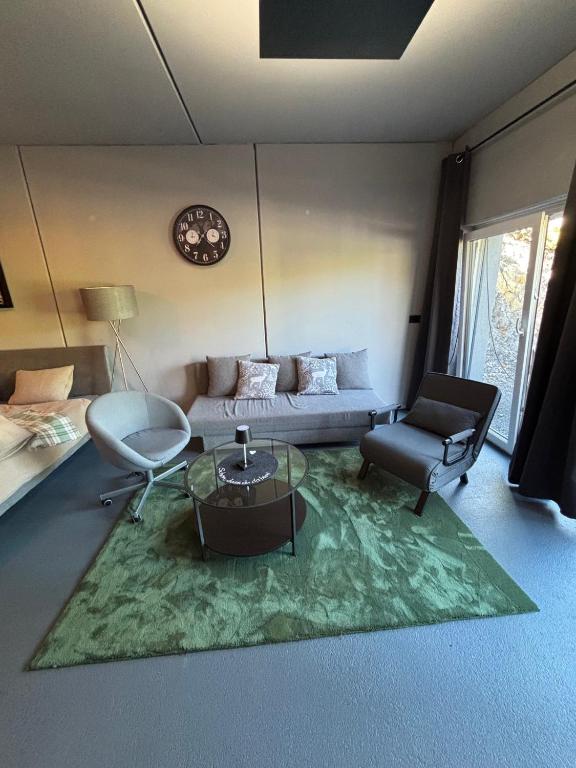 a living room with a couch and a table at Appartement Weiskopf in Reith bei Seefeld