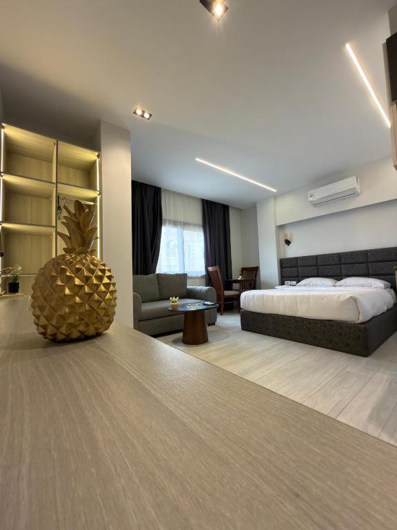 a hotel room with a bed and a couch at Regal view Aparthotel in Cairo