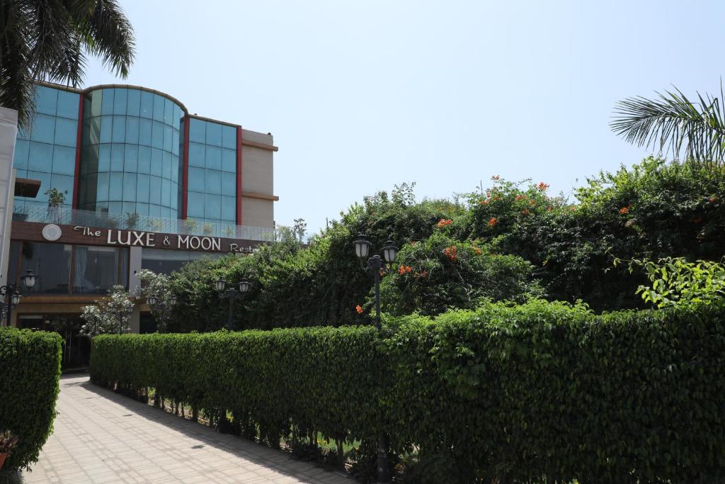 a building with a sign that reads the house a woman at Sona Pristine Hotel And Resort Ambala in Dhūlkot
