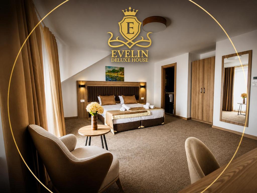 a hotel room with a king sized bed and a mirror at Evelin Deluxe House in Plovdiv