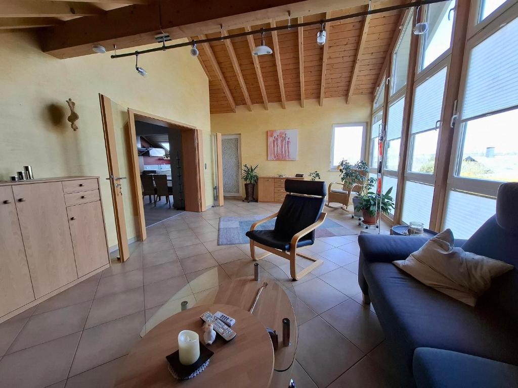 a living room with a couch and a table at Ferienwohnung Charbi in Simmern