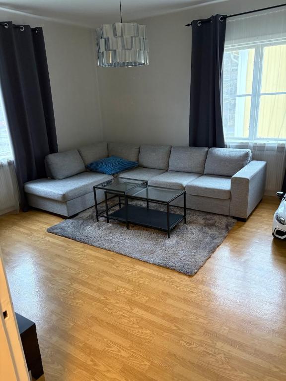 a living room with a couch and a table at Two rooms and kitchen in central Uddevalla in Uddevalla