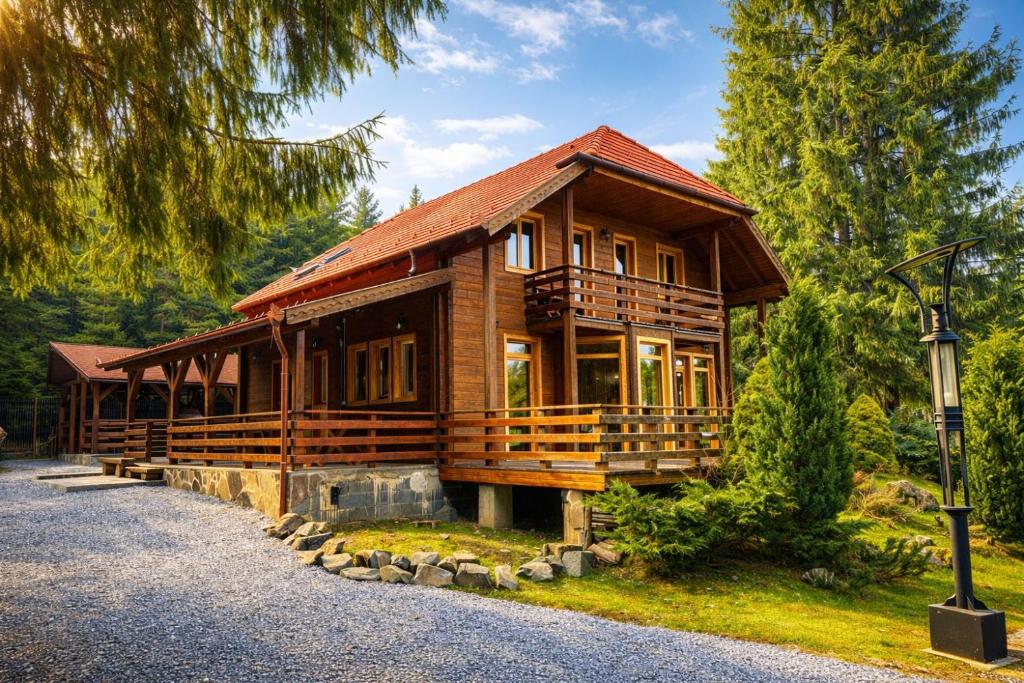 a large wooden house in the middle of a forest at Orion in Borzont