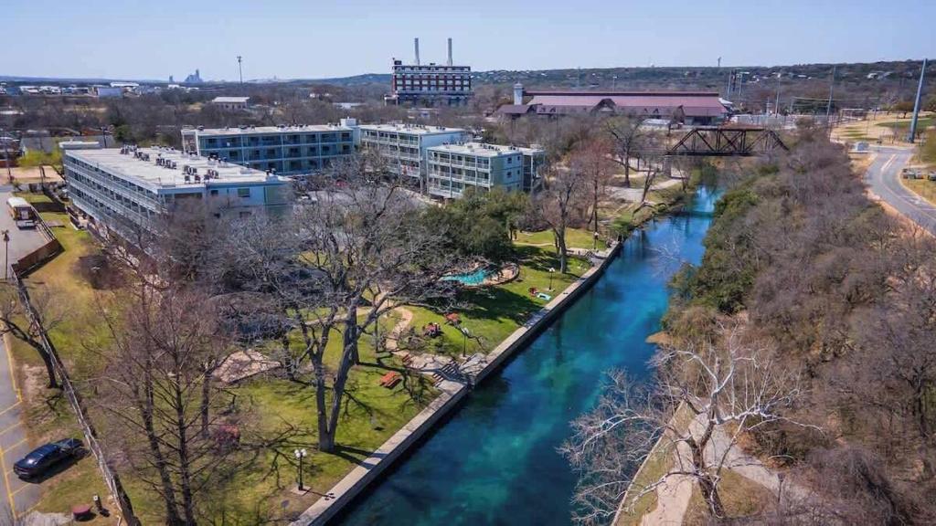 an aerial view of a river in a city at Treasure on Comal! in New Braunfels