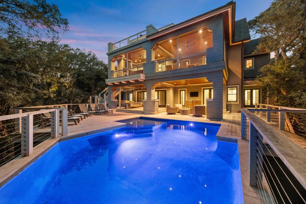 an exterior view of a house with a swimming pool at SS59: 59 Surfsong in Kiawah Island