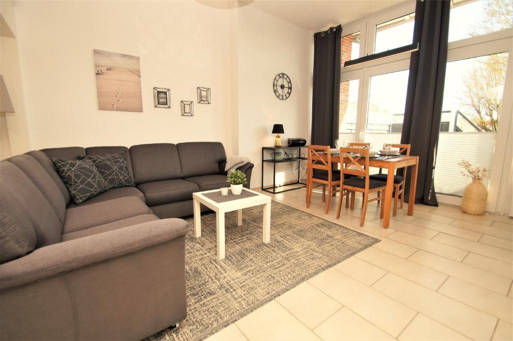a living room with a couch and a table at Nixe in Dahme