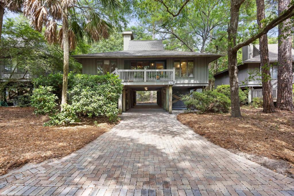 a home with a walkway leading to a house at IC106: 106 Inlet Cove in Kiawah Island