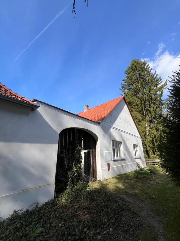 a white house with an open door at Statek Bavorov in Bavorov