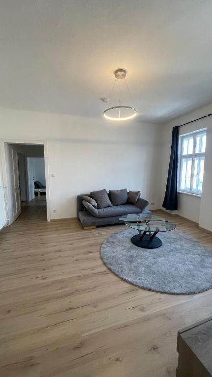 a living room with a couch and a rug at Großes Monteurhaus Großharras in Großharras