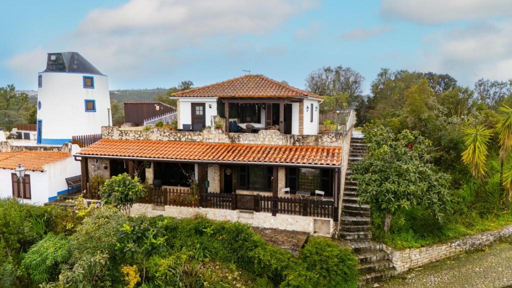 an aerial view of a house with a lighthouse at Banyan Tree in Óbidos