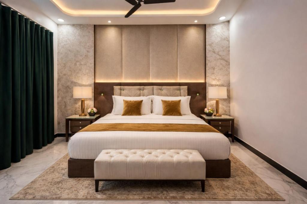 a bedroom with a large bed with a large headboard at Royal Awadh Inn in Ayodhya
