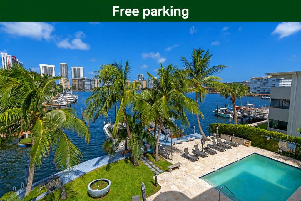 a view of the water at a resort with a swimming pool at Waterfront Luxe Condo - Close to beach in Hallandale Beach