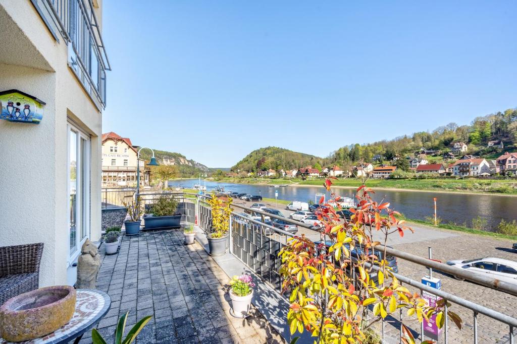 a balcony with a view of a river at Ferienwohnung Elbufer 3a in Stadt Wehlen