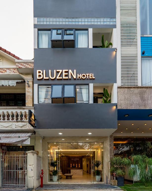 a hotel with a sign that reads bilayan hotel at Bluzen Hotel in Danang