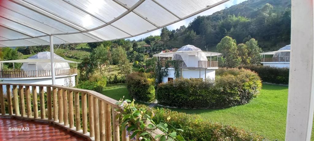 a view of a house from the balcony of a house at Cinco Elementos Glamping in Chiquinquirá